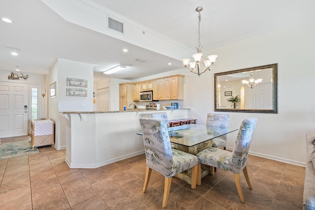 tiled dining area with ornamental molding and an inviting chandelier