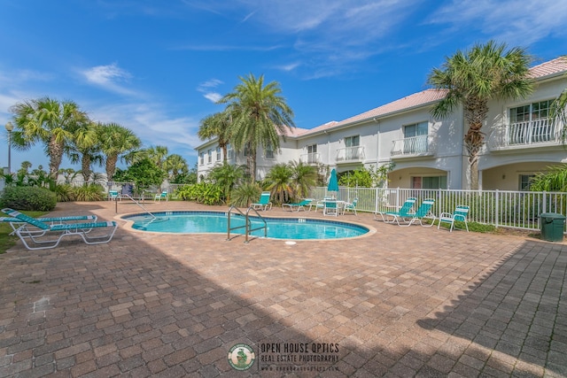 view of swimming pool with a patio area