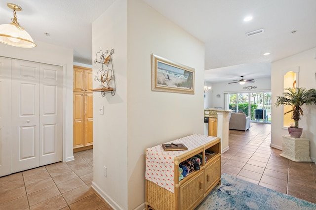 hallway with light tile patterned floors