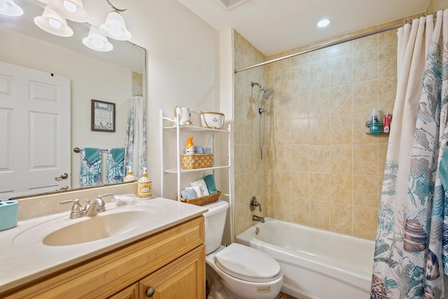 full bathroom featuring vanity, toilet, shower / bathtub combination with curtain, and a textured ceiling