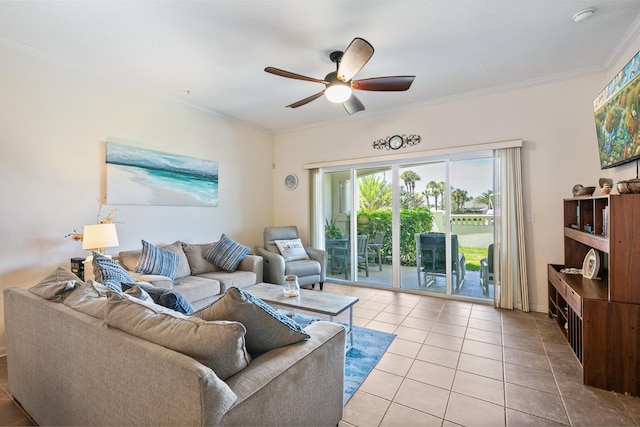 tiled living room with ceiling fan and crown molding