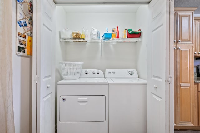 laundry area with washer and clothes dryer