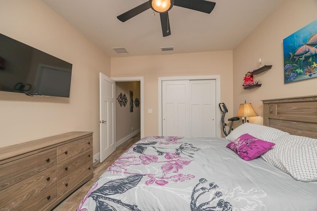 bedroom with ceiling fan and a closet