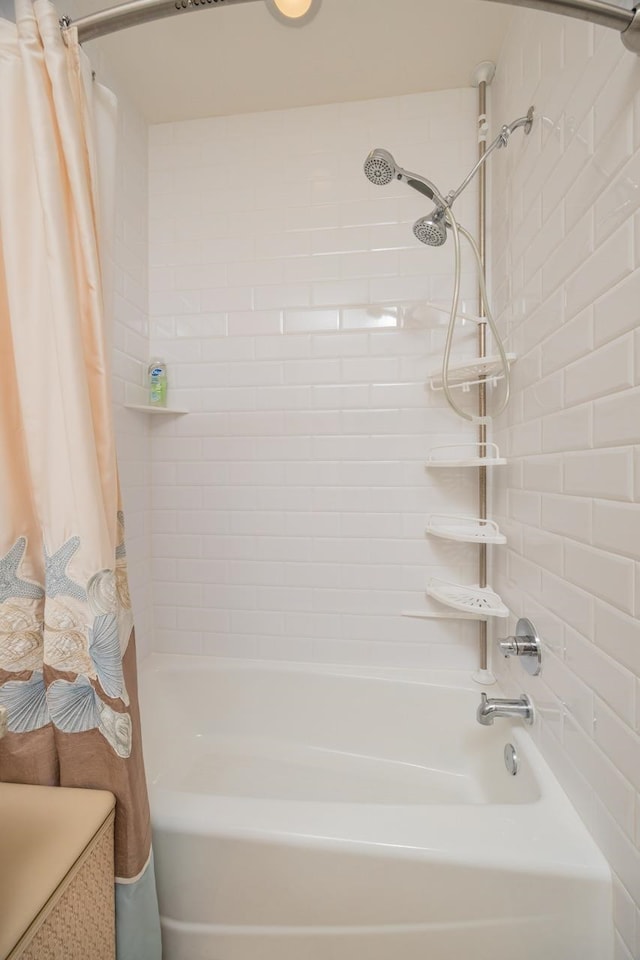 bathroom with shower / bath combo