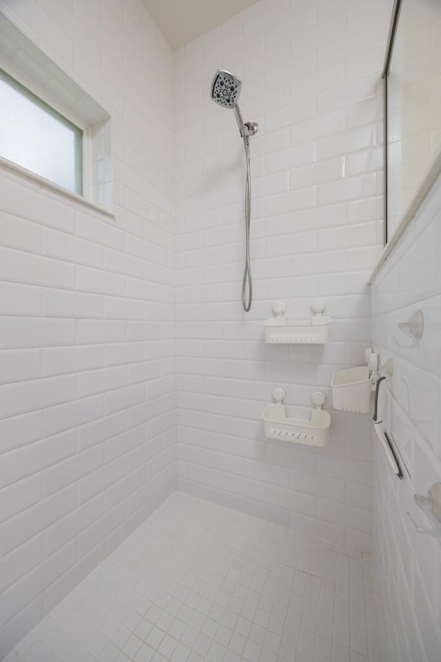 bathroom with tiled shower