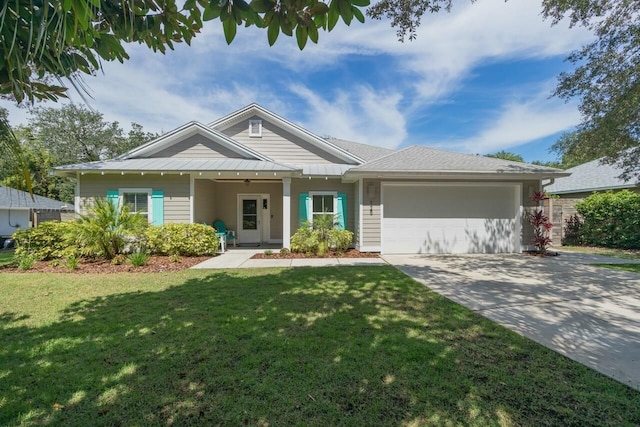 view of front of house with a front lawn and a garage