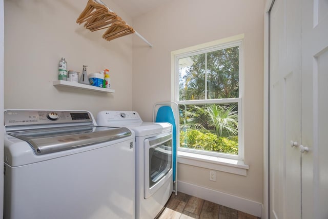 washroom featuring light wood-type flooring and washing machine and dryer