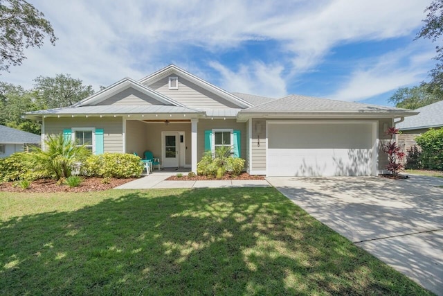 view of front of home featuring a front lawn and a garage