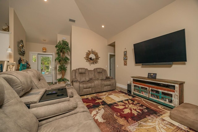 living room with high vaulted ceiling