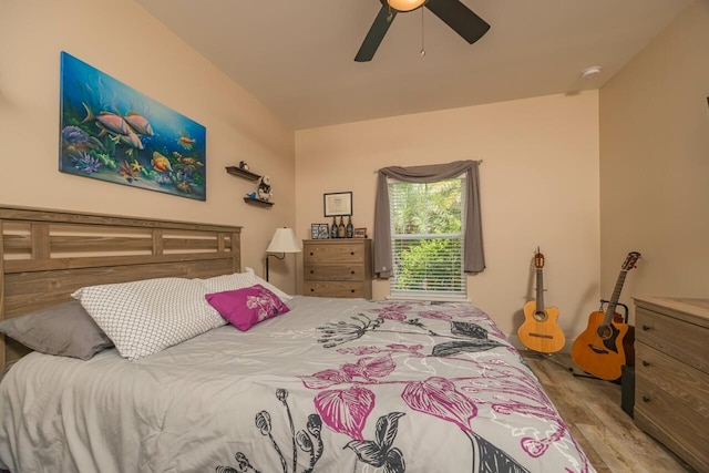 bedroom featuring ceiling fan and light hardwood / wood-style floors