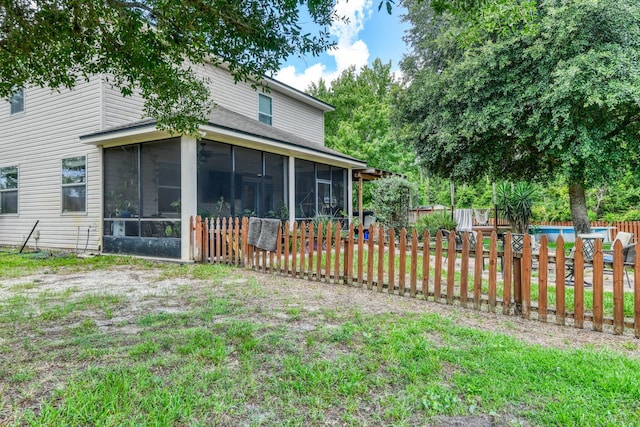 104 Claremont Ct, Elkton, FL 32033 - fenced backyard featuring a sunroom