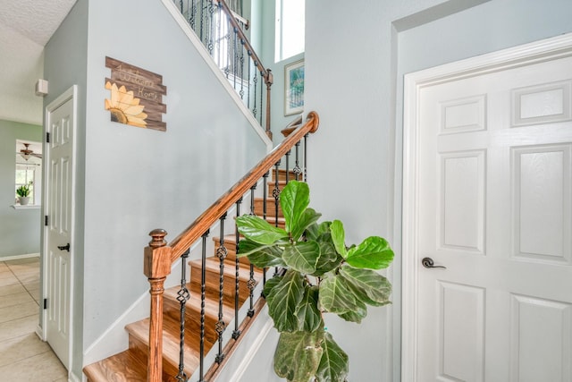 104 Claremont Ct, Elkton, FL 32033 - stairs with tile patterned floors and plenty of natural light