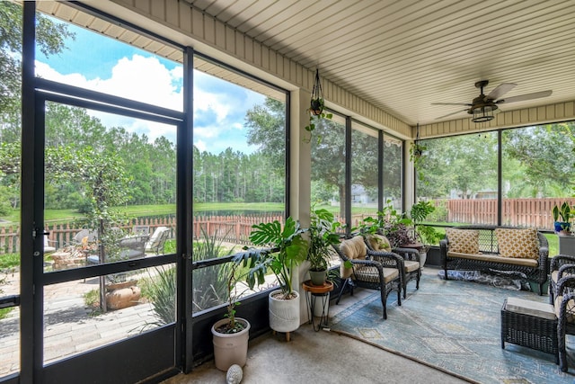 104 Claremont Ct, Elkton, FL 32033 - sunroom / solarium featuring a ceiling fan, an outdoor living space, and view of wooded area