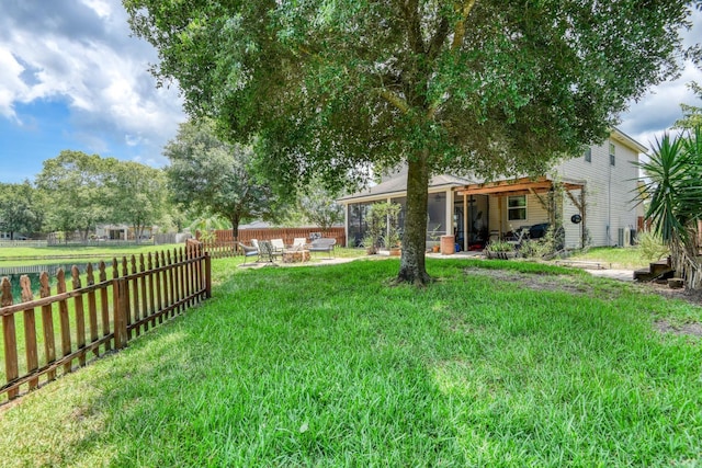 104 Claremont Ct, Elkton, FL 32033 - fenced backyard with an outdoor fire pit and a patio area