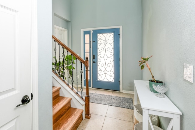 104 Claremont Ct, Elkton, FL 32033 - entrance foyer featuring stairs, light tile patterned flooring, and healthy amount of natural light