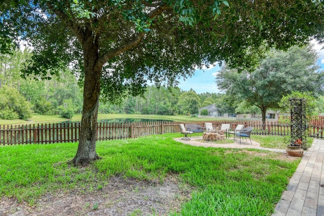 104 Claremont Ct, Elkton, FL 32033 - view of yard featuring an outdoor fire pit, a water view, and a patio