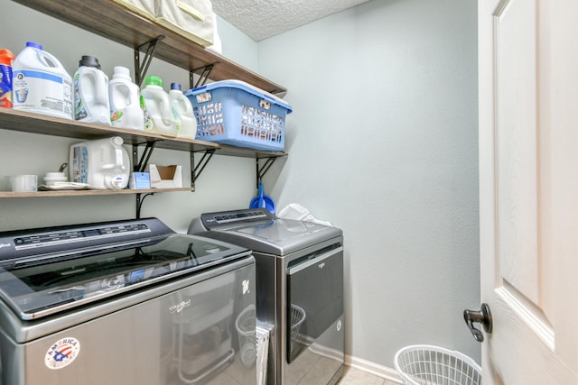 104 Claremont Ct, Elkton, FL 32033 - laundry area with washing machine and dryer, tile patterned flooring, and a textured ceiling