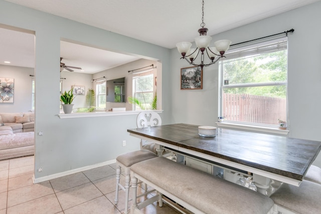 104 Claremont Ct, Elkton, FL 32033 - dining area with light tile patterned floors, a chandelier, and a ceiling fan