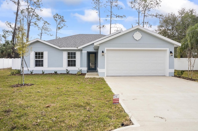 single story home featuring a garage and a front lawn