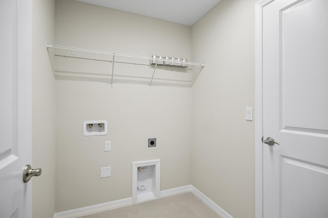 laundry area with electric dryer hookup, hookup for a washing machine, and light tile patterned flooring