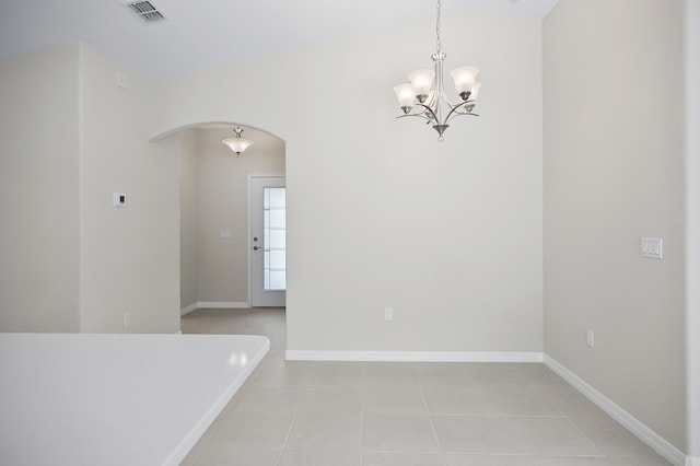 unfurnished room featuring light tile patterned floors