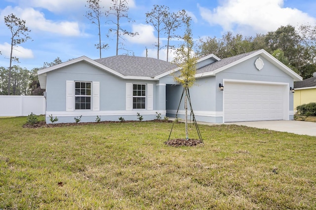 ranch-style house featuring a garage and a front yard