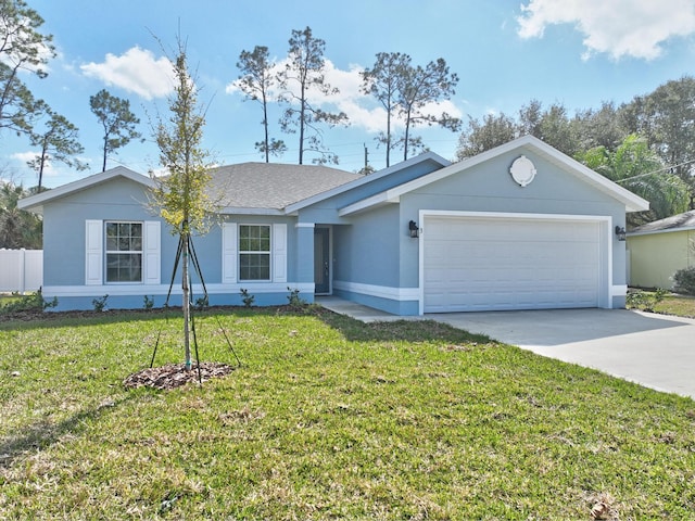 single story home featuring a garage and a front lawn