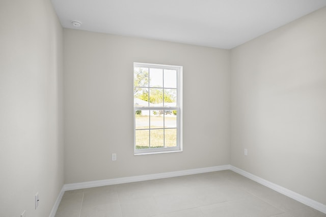 empty room with light tile patterned flooring