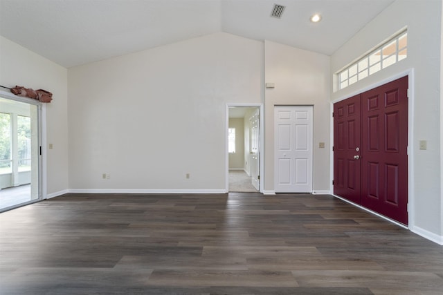 entrance foyer featuring high vaulted ceiling and dark wood-type flooring