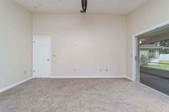 unfurnished room with light colored carpet