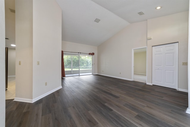 unfurnished living room featuring high vaulted ceiling and dark wood-type flooring