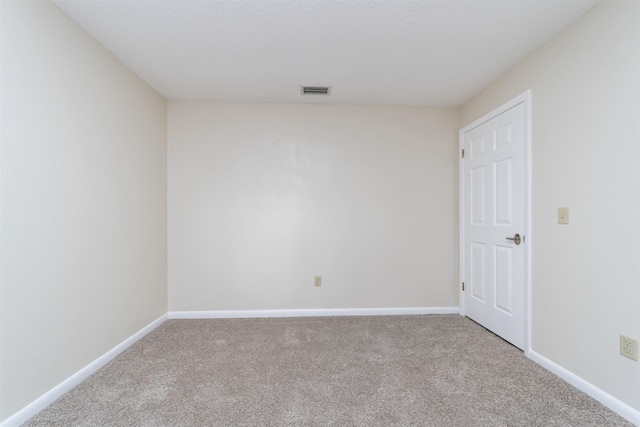 unfurnished room with carpet flooring