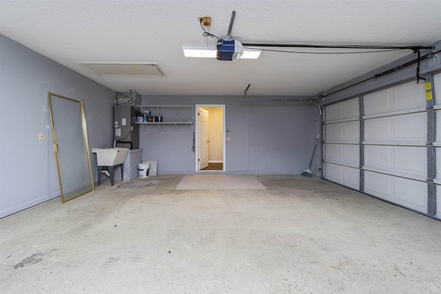 garage with sink and a garage door opener