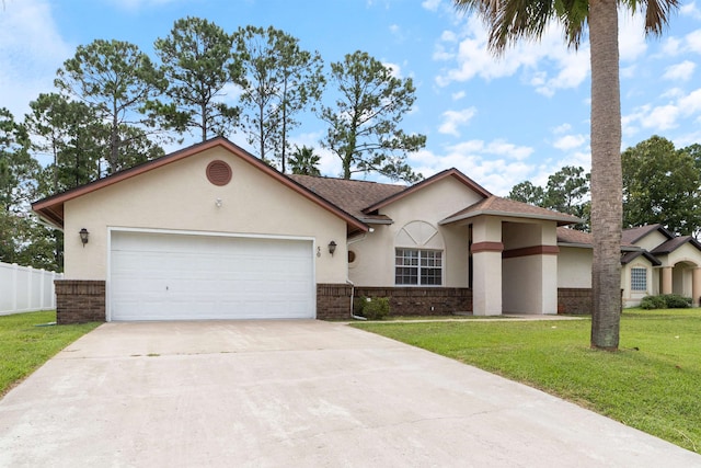 view of front of home with a front lawn and a garage