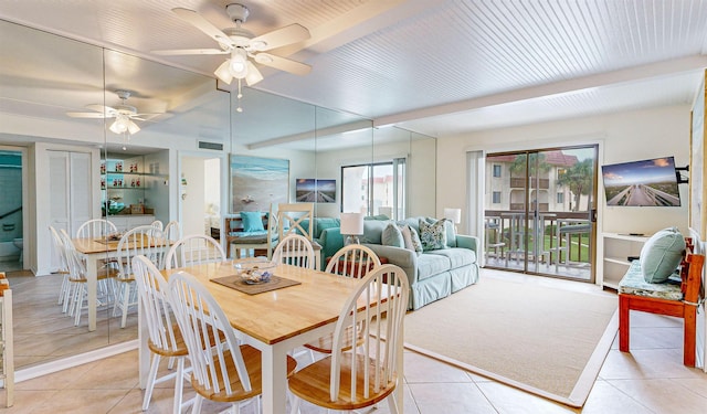 tiled dining space featuring ceiling fan