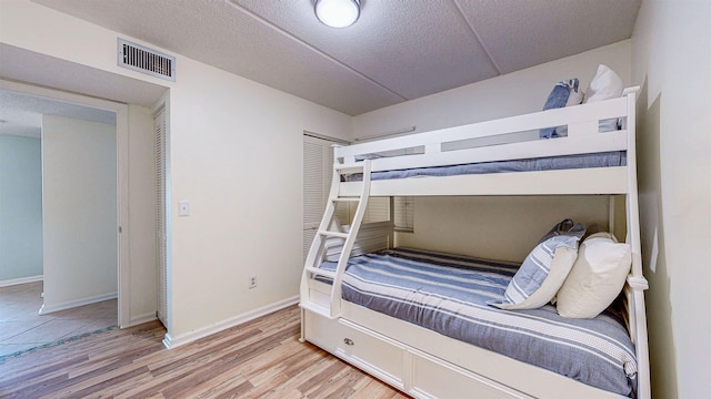 bedroom with light hardwood / wood-style flooring