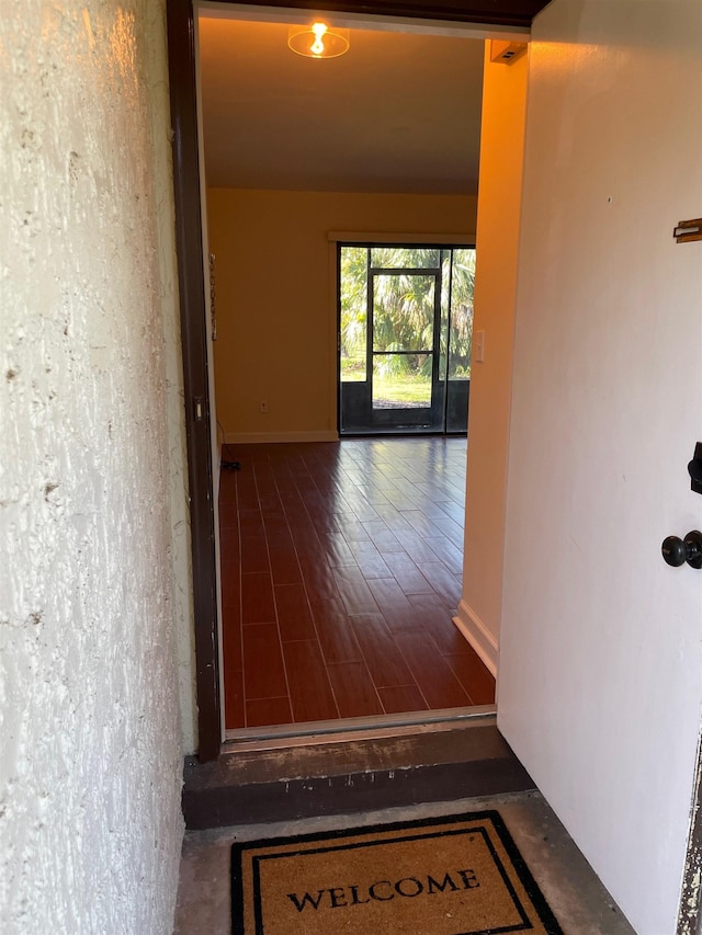 hall with wood-type flooring