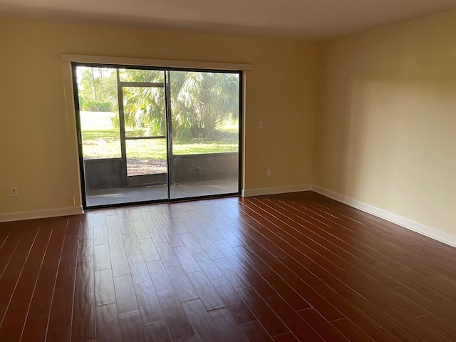 spare room featuring dark hardwood / wood-style flooring