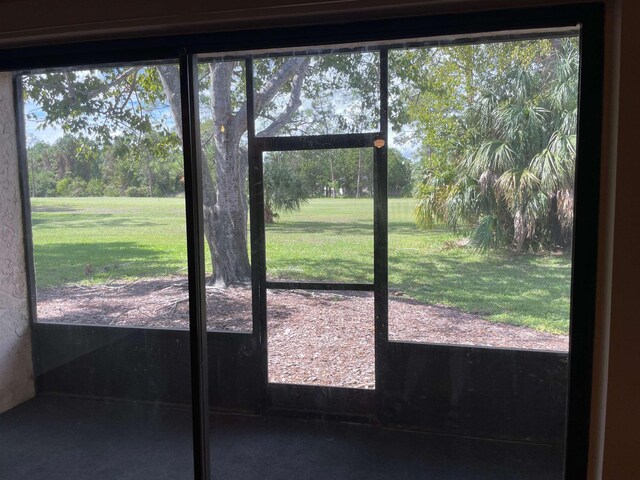 doorway to outside featuring a healthy amount of sunlight