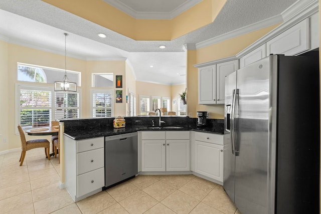 kitchen featuring white cabinetry, sink, ornamental molding, light tile patterned floors, and stainless steel appliances