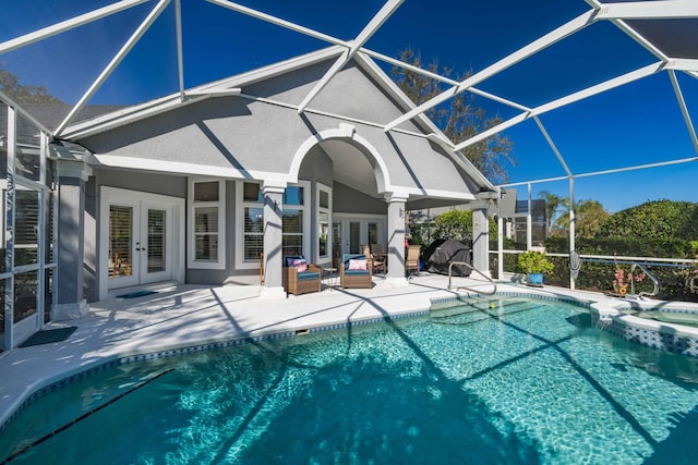 view of swimming pool featuring french doors, an in ground hot tub, and a patio