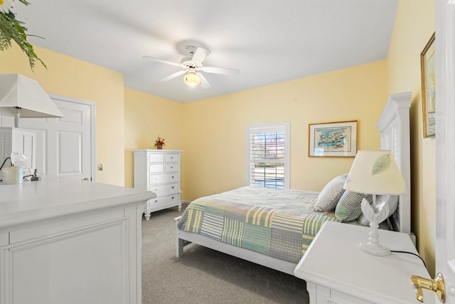 carpeted bedroom with ceiling fan