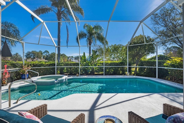 view of swimming pool with an in ground hot tub and glass enclosure