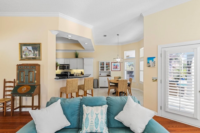 living room featuring hardwood / wood-style floors and ornamental molding