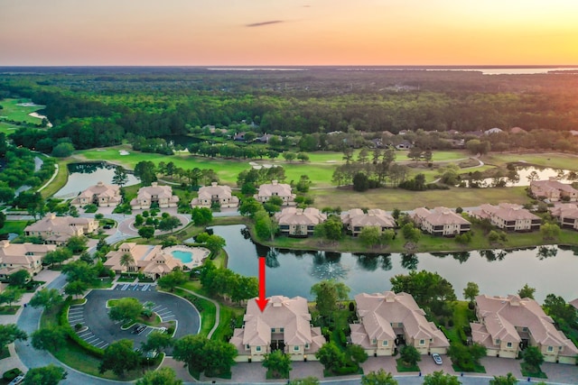 175 Laterra Links Cir Unit 101, Saint Augustine, FL 32092 - aerial view at dusk with a wooded view, a water view, and a residential view