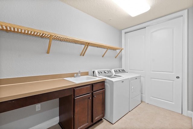 175 Laterra Links Cir Unit 101, Saint Augustine, FL 32092 - washroom with washing machine and dryer, cabinet space, and a sink