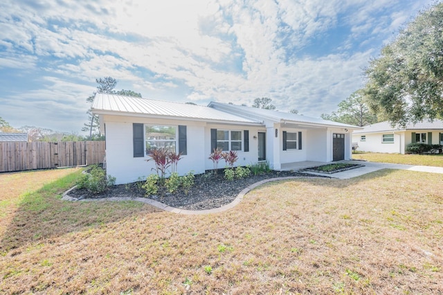 ranch-style home with a front lawn