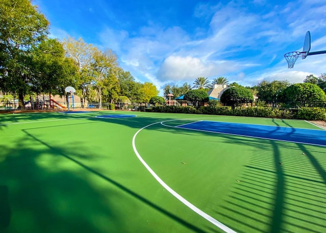 view of basketball court with community basketball court and fence