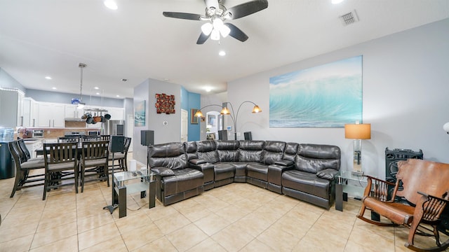 living area featuring light tile patterned floors, visible vents, recessed lighting, and a ceiling fan