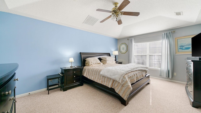 bedroom featuring visible vents, light colored carpet, and baseboards